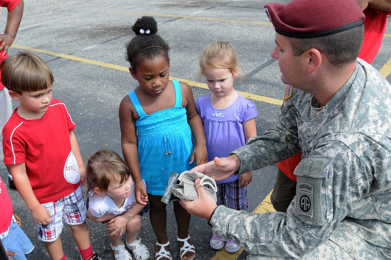 Spc. Paul Mampreian holds an emergency pressure dressing during a demonstration of the first aid equipment that Paratroopers use during a…